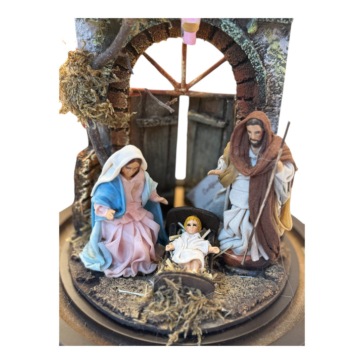 Nativity scene in a bell with terracotta characters and real clothes
