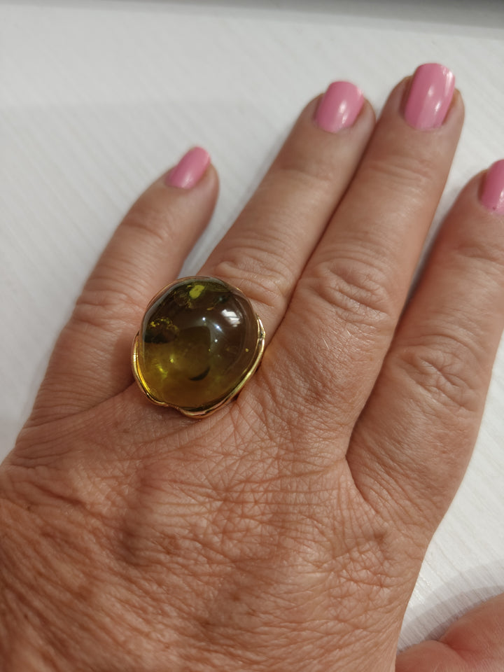 Green amber ring mounted on silver