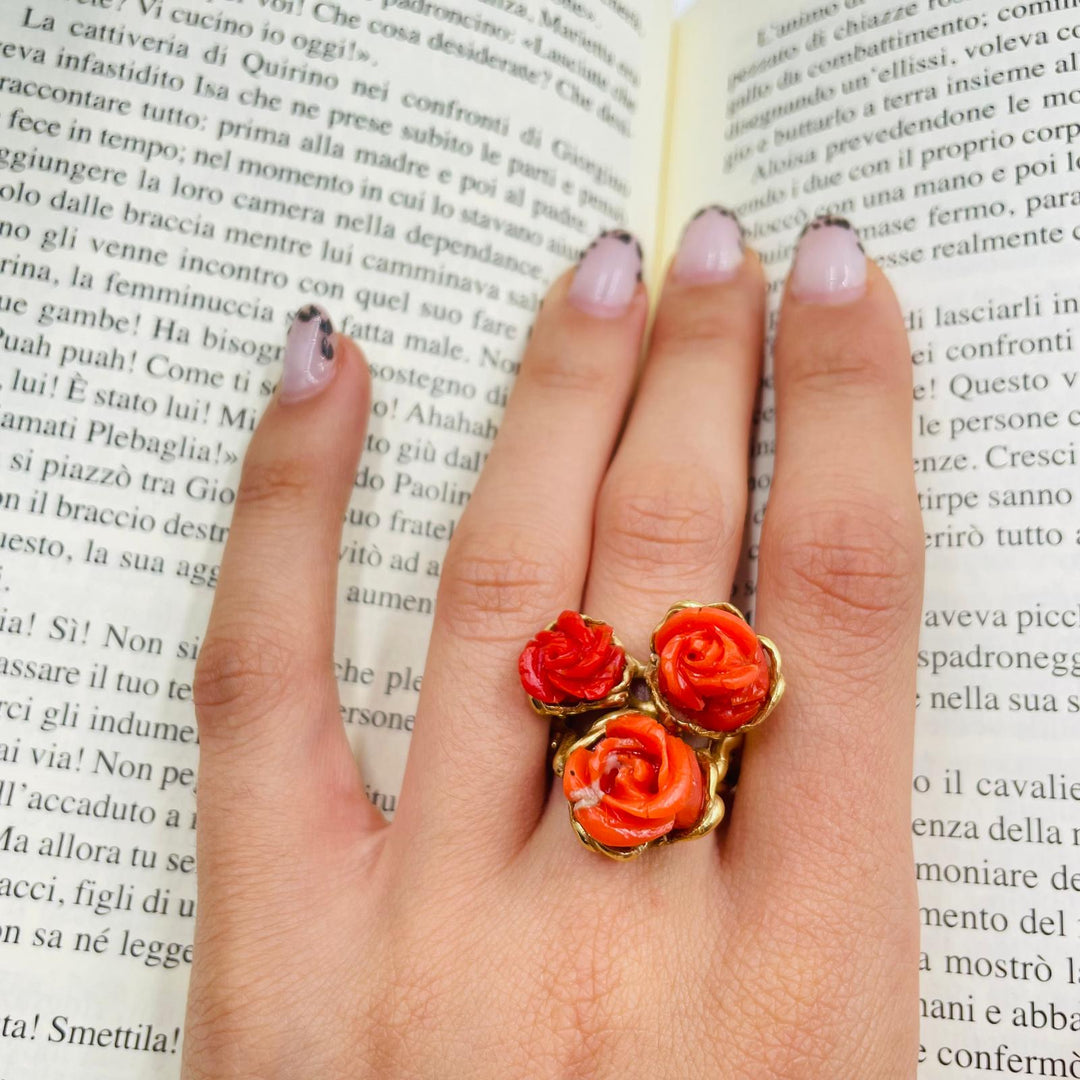 Three coral roses ring mounted on silver