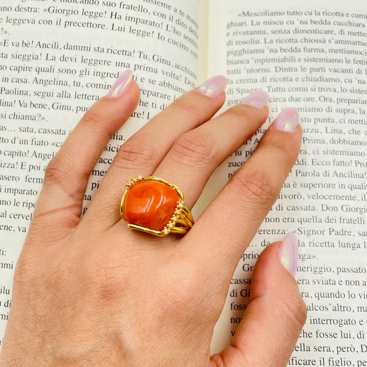 Coral stone and zirconia ring mounted on silver