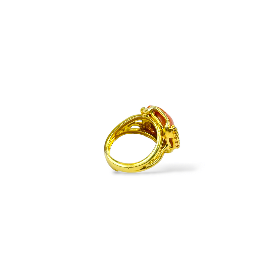 Coral stone and zirconia ring mounted on silver
