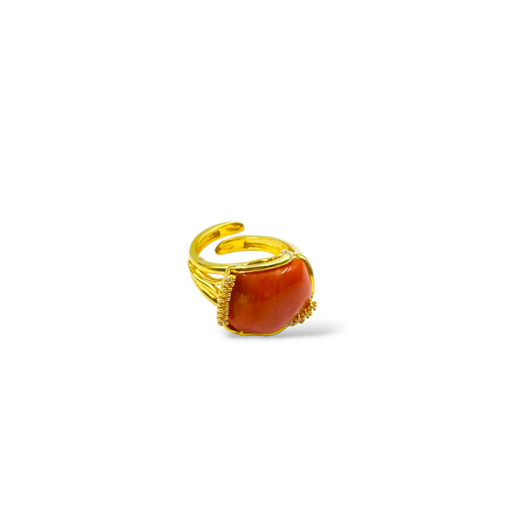 Coral stone and zirconia ring mounted on silver