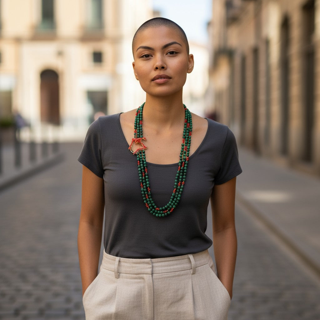 Multi-strand necklace of malachite and coral set in silver