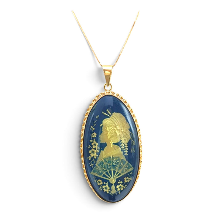 Ciondolo Geisha di Ambra blu montato in Argento Dorato