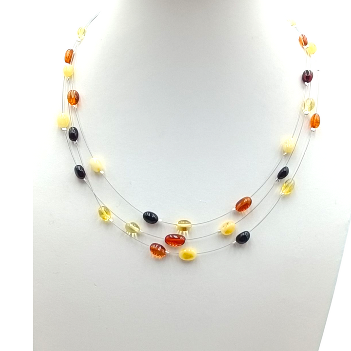 Multi-strand and multi-colored amber necklace mounted on silver