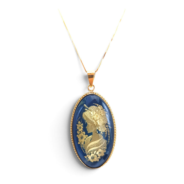 Ciondolo Geisha di Ambra blu montato in Argento Dorato