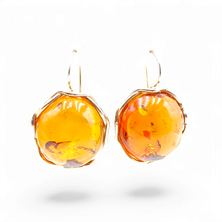 Red amber earrings mounted on gold plated silver