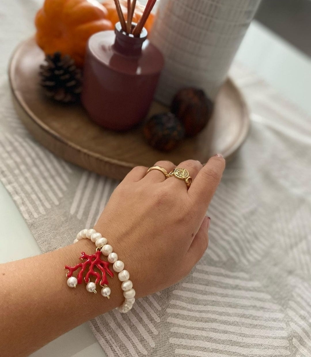 Bracelet of pearls and enameled branch