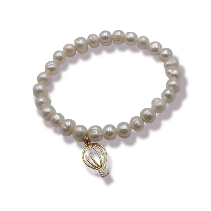 Charm bracelets on pearls