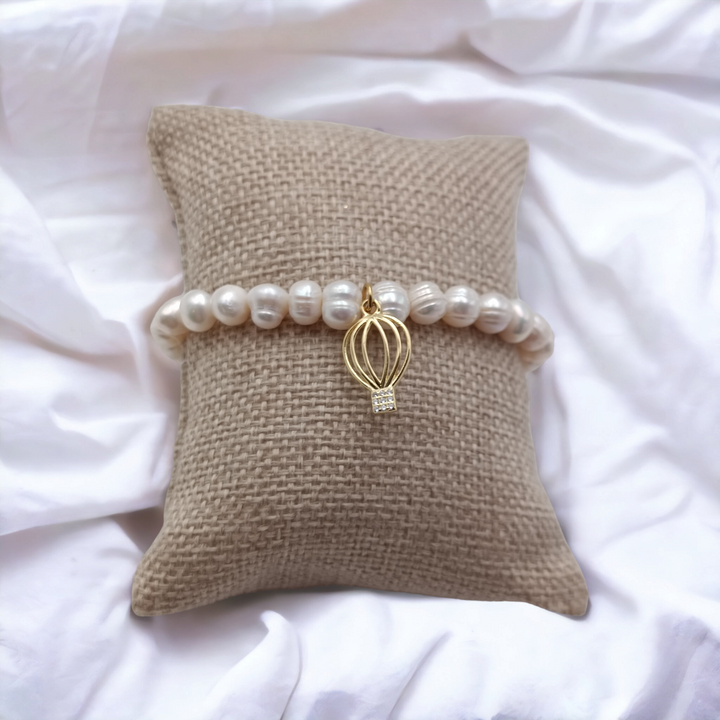 Charm bracelets on pearls